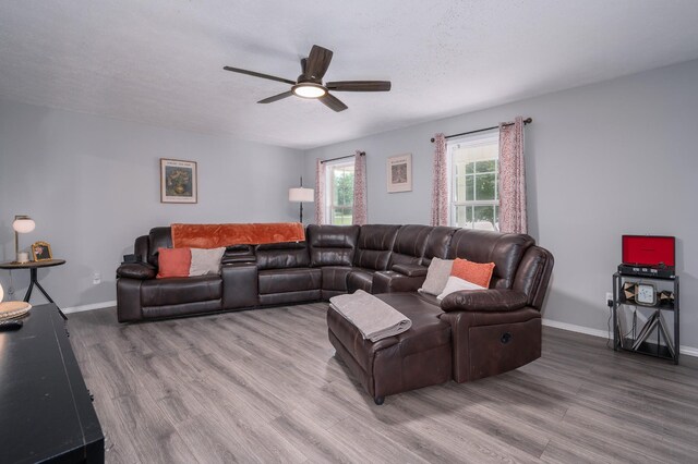 115 Pin Oaks Ln, Hohenwald, TN 38462 - living area featuring a ceiling fan, wood finished floors, and baseboards