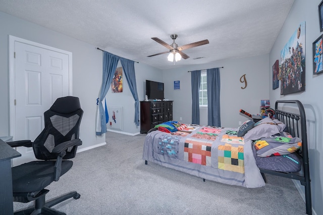 115 Pin Oaks Ln, Hohenwald, TN 38462 - bedroom with carpet floors, a textured ceiling, a ceiling fan, and baseboards