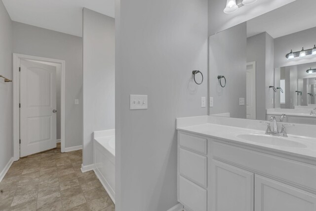 4015 Brazelton Way, Fairview, TN 37062 - bathroom with baseboards, a garden tub, and vanity