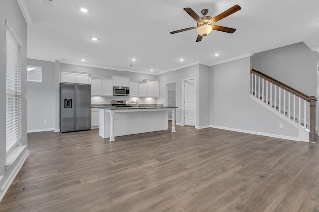 4015 Brazelton Way, Fairview, TN 37062 - kitchen with stainless steel appliances, open floor plan, a kitchen island with sink, ceiling fan, and ornamental molding