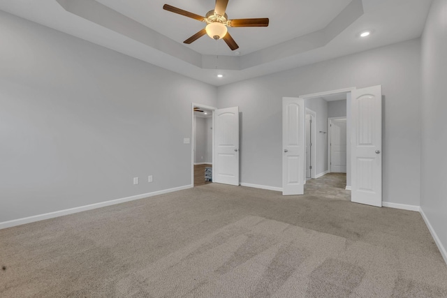 4015 Brazelton Way, Fairview, TN 37062 - unfurnished bedroom featuring carpet flooring, baseboards, recessed lighting, and a tray ceiling