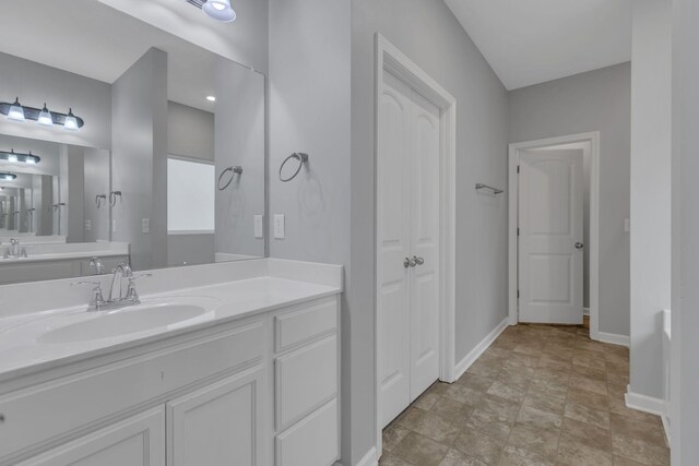 4015 Brazelton Way, Fairview, TN 37062 - bathroom with vanity, baseboards, and stone finish floors