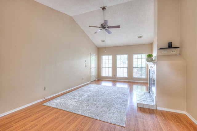 302 Laurel Hill Dr, Old Hickory, TN 37138 - unfurnished living room with ceiling fan, wood finished floors, baseboards, and high vaulted ceiling
