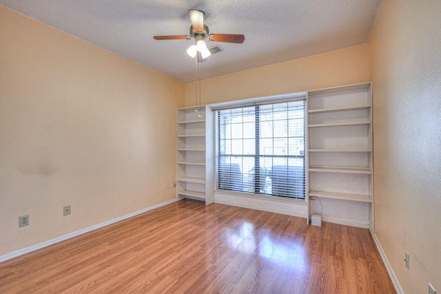 302 Laurel Hill Dr, Old Hickory, TN 37138 - empty room with a ceiling fan, light wood-type flooring, baseboards, and a textured ceiling