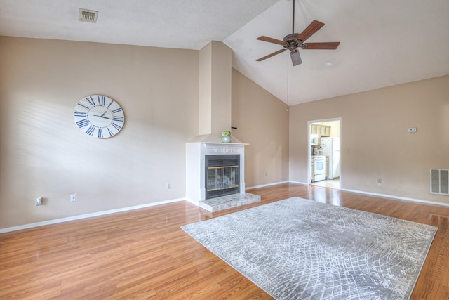 302 Laurel Hill Dr, Old Hickory, TN 37138 - living room featuring high vaulted ceiling, ceiling fan, baseboards, a fireplace, and light wood finished floors