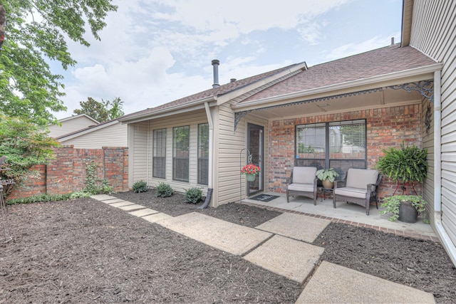 302 Laurel Hill Dr, Old Hickory, TN 37138 - back of house featuring a patio area, brick siding, and roof with shingles