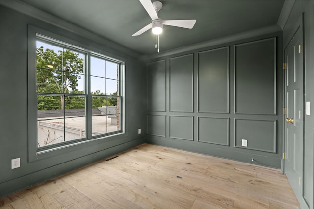 1701 Portland Ave Unit E, Nashville, TN 37212 - spare room with a decorative wall, ceiling fan, and light wood-style flooring