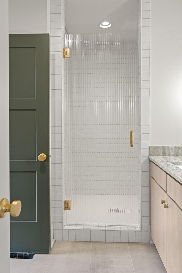 1701 Portland Ave Unit E, Nashville, TN 37212 - bathroom with tile patterned flooring, a shower stall, vanity, and recessed lighting