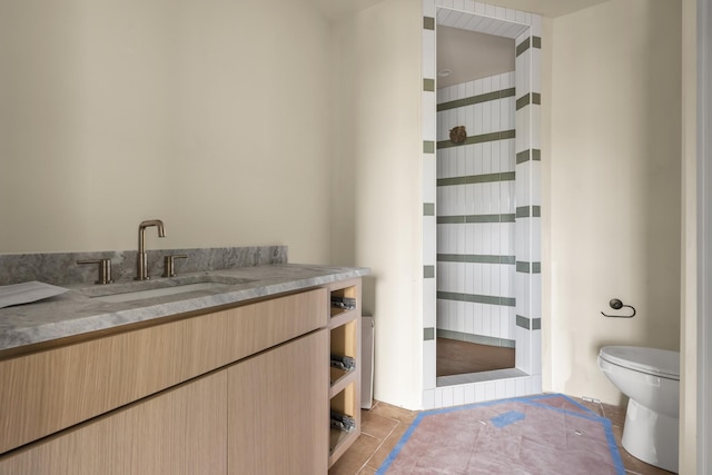 1701 Portland Ave Unit E, Nashville, TN 37212 - bathroom featuring vanity, toilet, tile patterned flooring, and a shower with shower curtain