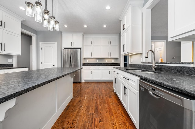 167 Lancaster St, Hillsboro, TN 37342 - kitchen with stainless steel appliances, a sink, dark wood finished floors, white cabinets, and recessed lighting