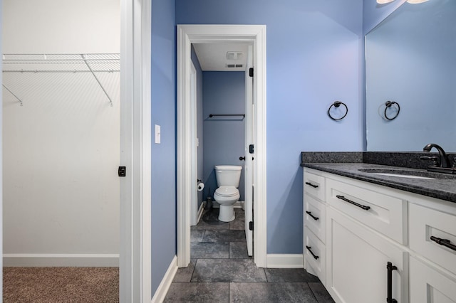 167 Lancaster St, Hillsboro, TN 37342 - bathroom featuring vanity, toilet, a walk in closet, and baseboards
