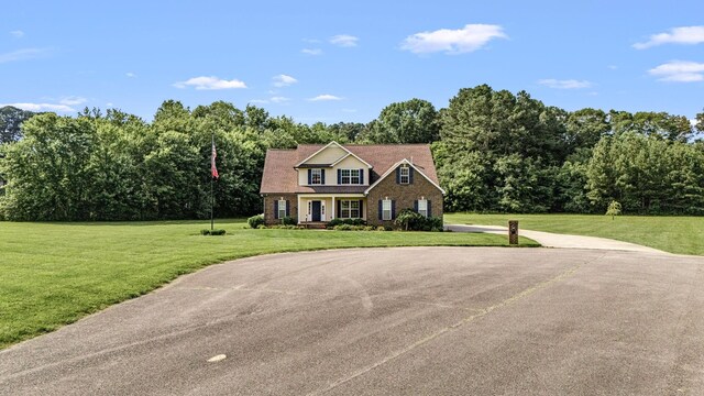 167 Lancaster St, Hillsboro, TN 37342 - view of front of home featuring a front yard and brick siding