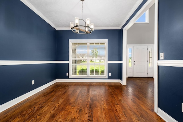 167 Lancaster St, Hillsboro, TN 37342 - unfurnished dining area with a chandelier, baseboards, wood finished floors, and crown molding