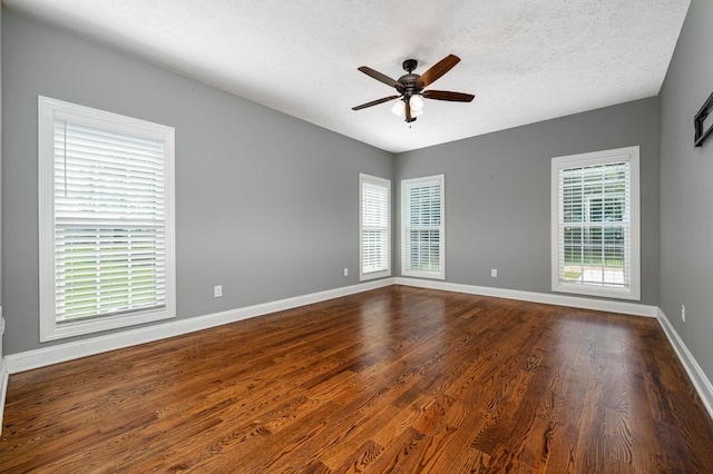 167 Lancaster St, Hillsboro, TN 37342 - empty room featuring a ceiling fan, dark wood-style floors, baseboards, and a textured ceiling