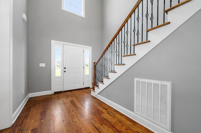 167 Lancaster St, Hillsboro, TN 37342 - foyer entrance featuring a towering ceiling, stairway, wood finished floors, and baseboards