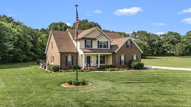 167 Lancaster St, Hillsboro, TN 37342 - view of front of house featuring brick siding, a front lawn, and covered porch