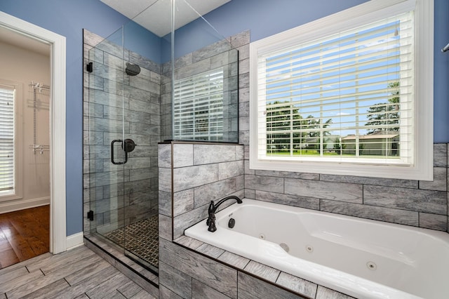 167 Lancaster St, Hillsboro, TN 37342 - full bath with a stall shower, a whirlpool tub, and wood finished floors