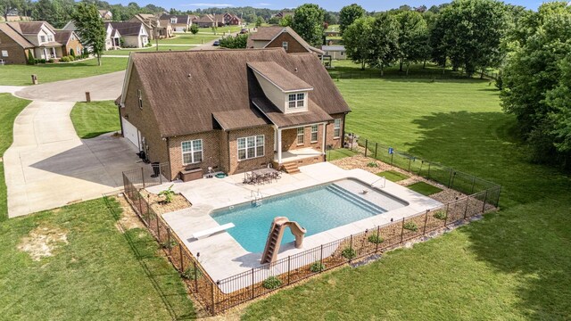 167 Lancaster St, Hillsboro, TN 37342 - back of house with concrete driveway, a patio area, brick siding, a residential view, and a shingled roof