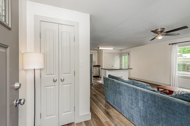 349 Dawn Dr, Cedar Hill, TN 37032 - living room with wood finished floors, a ceiling fan, and baseboards