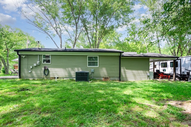 349 Dawn Dr, Cedar Hill, TN 37032 - back of property featuring central air condition unit and a yard
