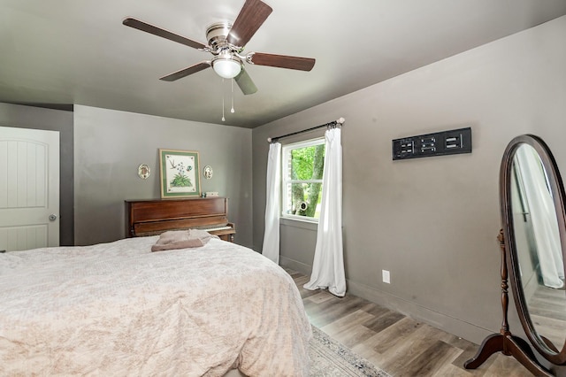 349 Dawn Dr, Cedar Hill, TN 37032 - bedroom featuring wood finished floors, baseboards, and ceiling fan