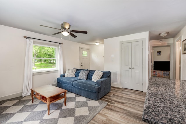 349 Dawn Dr, Cedar Hill, TN 37032 - living area featuring a ceiling fan, light wood finished floors, and baseboards