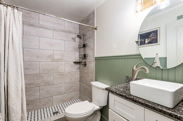 349 Dawn Dr, Cedar Hill, TN 37032 - bathroom with vanity, toilet, a wainscoted wall, and a tile shower