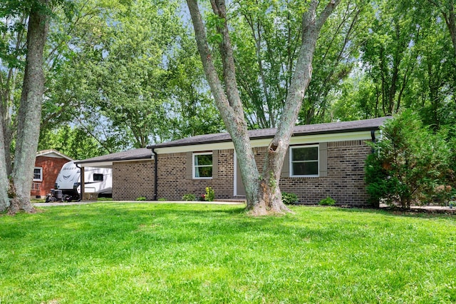 349 Dawn Dr, Cedar Hill, TN 37032 - view of front of property featuring brick siding and a front lawn