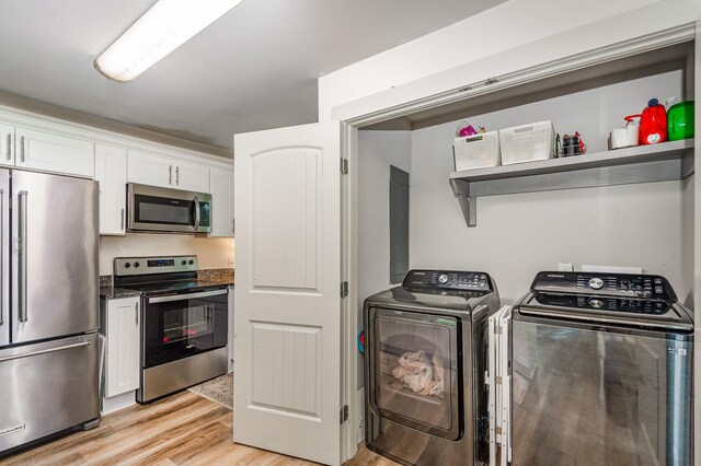 349 Dawn Dr, Cedar Hill, TN 37032 - washroom with washing machine and clothes dryer and light wood finished floors