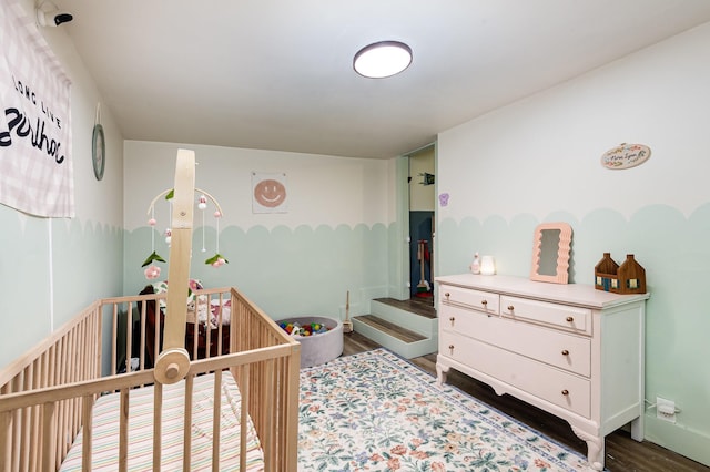 349 Dawn Dr, Cedar Hill, TN 37032 - bedroom with dark wood-style floors and a crib