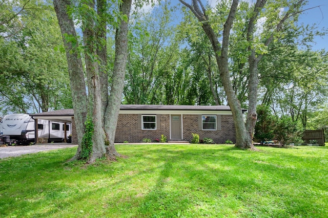 349 Dawn Dr, Cedar Hill, TN 37032 - view of front facade with brick siding, a front yard, and driveway