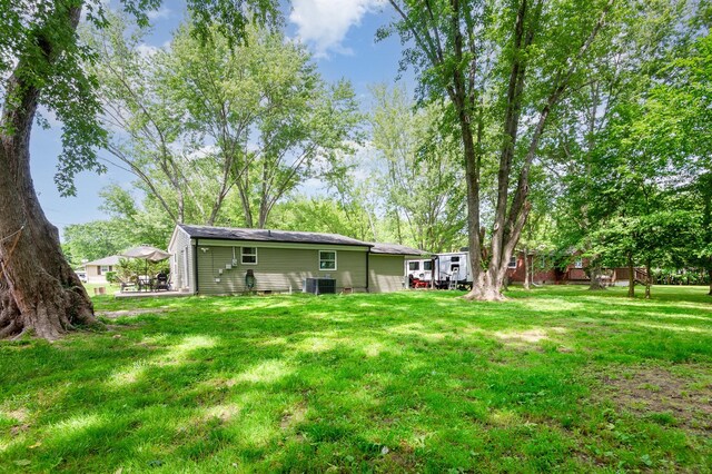 349 Dawn Dr, Cedar Hill, TN 37032 - back of house featuring a yard and cooling unit