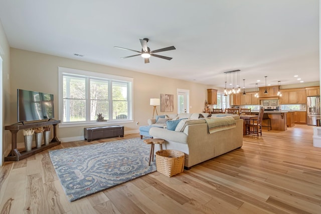 2825 Oregon Rd, Milton, TN 37118 - living area featuring ceiling fan, light wood-style floors, baseboards, a chandelier, and recessed lighting