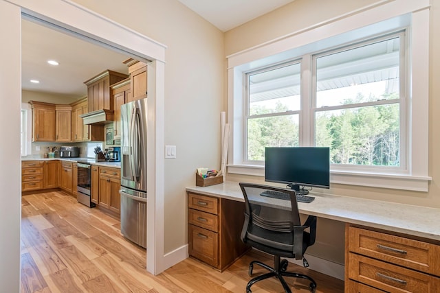 2825 Oregon Rd, Milton, TN 37118 - office area with built in desk, light wood-style flooring, and recessed lighting
