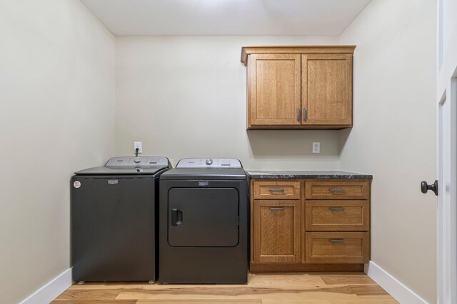 2825 Oregon Rd, Milton, TN 37118 - washroom with washer and clothes dryer, cabinet space, baseboards, and light wood-style flooring