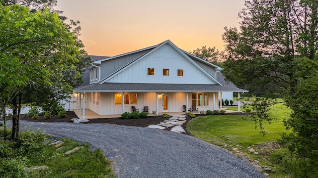 2825 Oregon Rd, Milton, TN 37118 - modern farmhouse style home featuring covered porch, a shingled roof, a yard, and gravel driveway