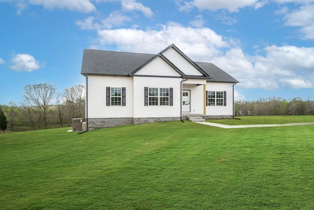 1502 Rock Springs Rd, Cumberland Furnace, TN 37051 - view of front of home with a front lawn, a shingled roof, and central AC
