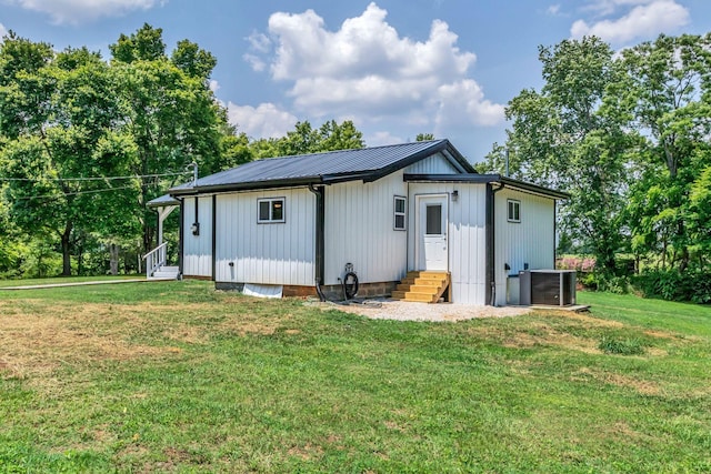 325 Francis Rd, Decherd, TN 37324 - rear view of property with entry steps, cooling unit, a yard, and metal roof