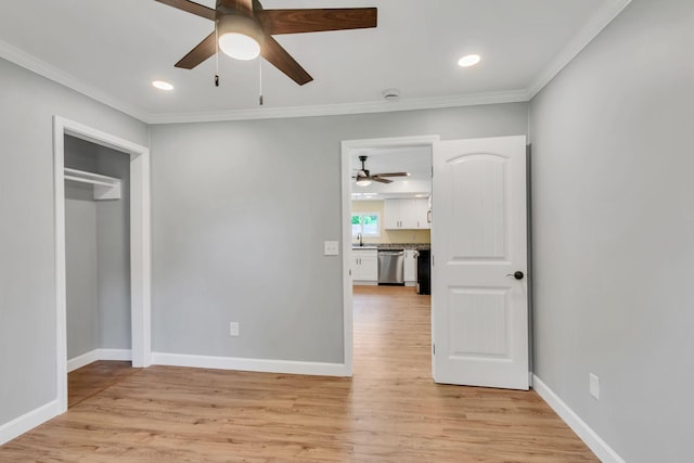 325 Francis Rd, Decherd, TN 37324 - unfurnished bedroom featuring light wood finished floors, ornamental molding, baseboards, a sink, and a ceiling fan
