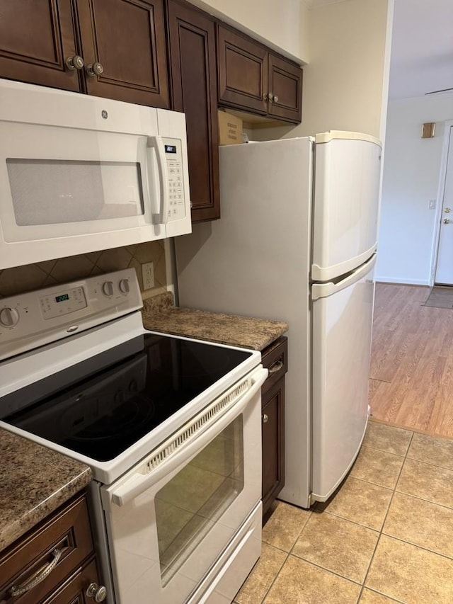 2929 Selena Dr Unit B30, Nashville, TN 37211 - kitchen featuring white appliances, dark brown cabinets, and light tile patterned floors