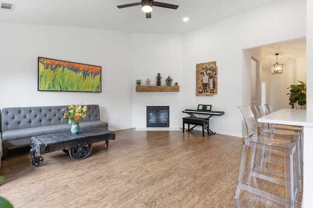 3164 Winberry Dr, Franklin, TN 37064 - living room featuring wood finished floors, a ceiling fan, a brick fireplace, baseboards, and recessed lighting