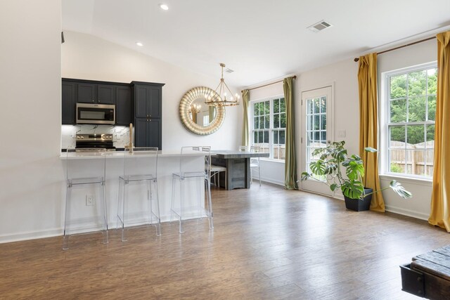 3164 Winberry Dr, Franklin, TN 37064 - kitchen featuring stainless steel appliances, a chandelier, light countertops, dark cabinets, and lofted ceiling