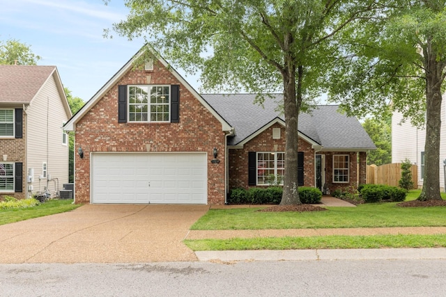 3164 Winberry Dr, Franklin, TN 37064 - traditional-style home with driveway, brick siding, central air condition unit, an attached garage, and roof with shingles