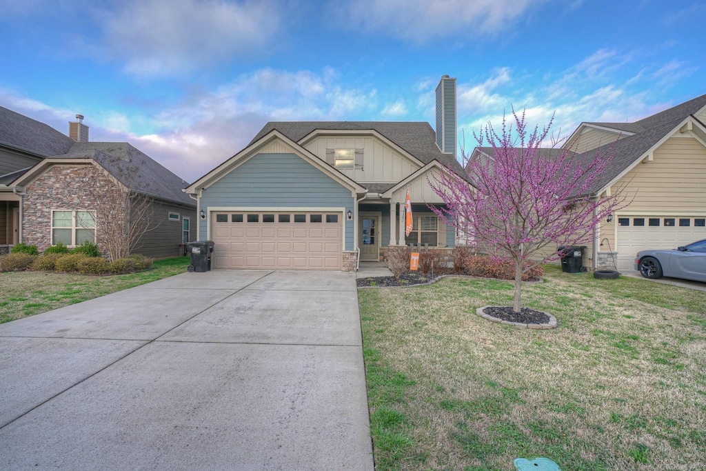 5846 Enclave Dr, Murfreesboro, TN 37128 - view of front of property featuring board and batten siding, a garage, a chimney, concrete driveway, and a front yard