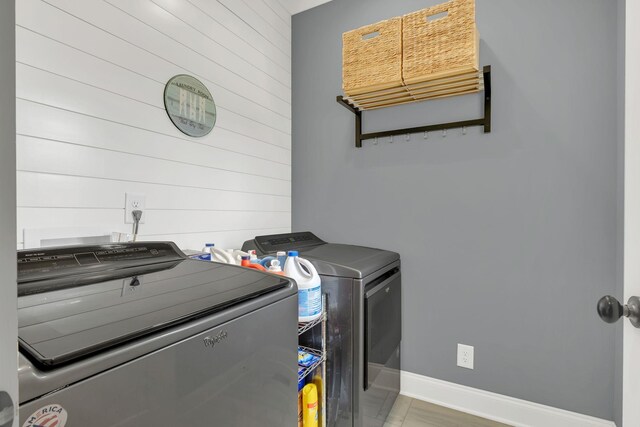 2732 Cherrydale Dr, Lebanon, TN 37087 - washroom with washing machine and dryer, baseboards, and wooden walls