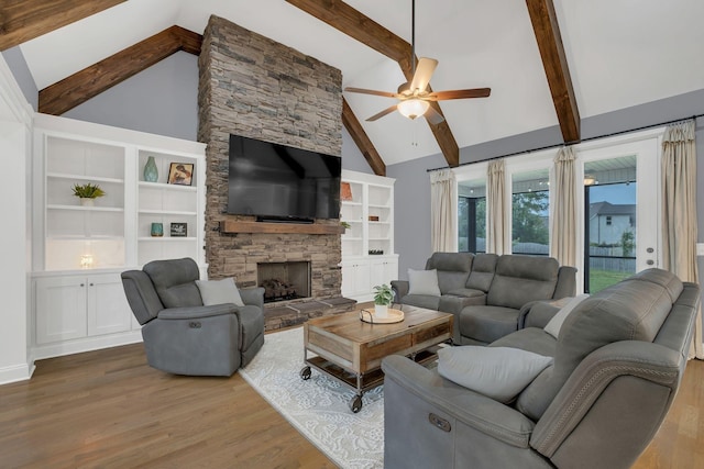 2732 Cherrydale Dr, Lebanon, TN 37087 - living room with wood finished floors, a ceiling fan, high vaulted ceiling, beam ceiling, and a stone fireplace