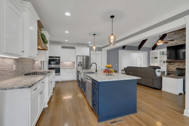 2732 Cherrydale Dr, Lebanon, TN 37087 - kitchen featuring appliances with stainless steel finishes, blue cabinetry, white cabinets, ceiling fan, and recessed lighting