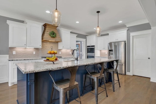 2732 Cherrydale Dr, Lebanon, TN 37087 - kitchen with stainless steel appliances, crown molding, backsplash, white cabinets, and premium range hood