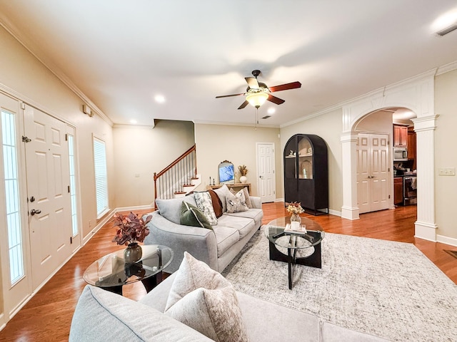 2138 Cason Ln, Murfreesboro, TN 37128 - living room with arched walkways, decorative columns, stairs, wood finished floors, and ceiling fan