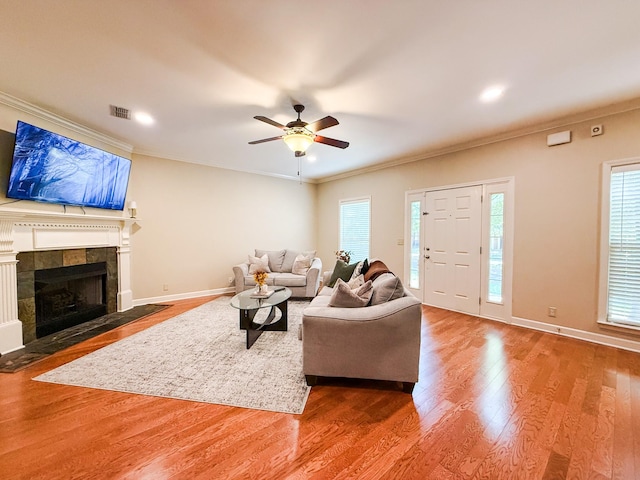 2138 Cason Ln, Murfreesboro, TN 37128 - living room with crown molding, healthy amount of natural light, ceiling fan, wood finished floors, and baseboards
